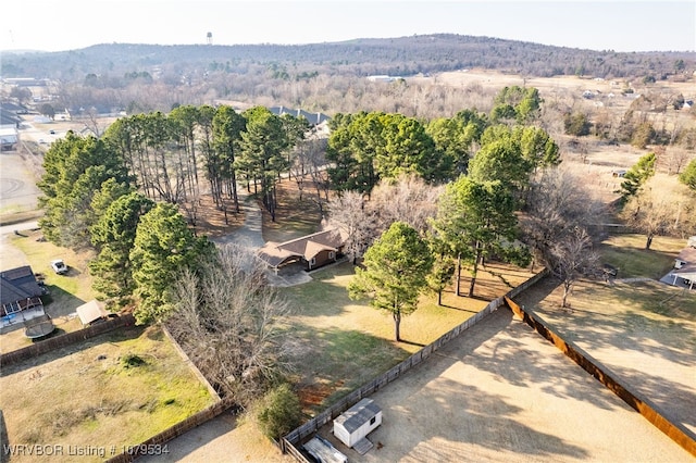 birds eye view of property with a forest view