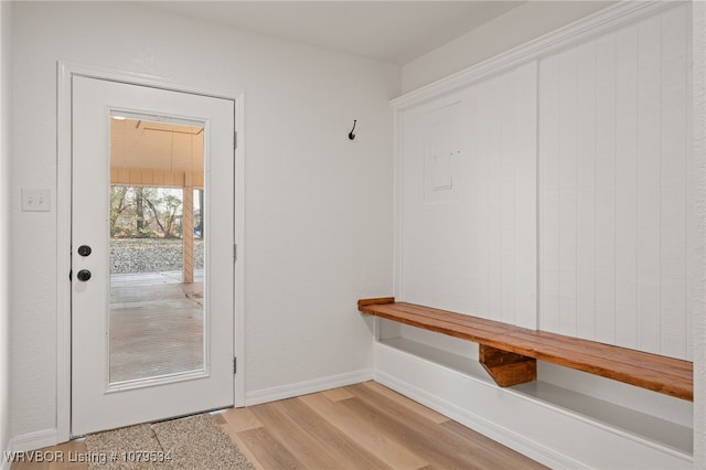 mudroom featuring baseboards and light wood-style floors