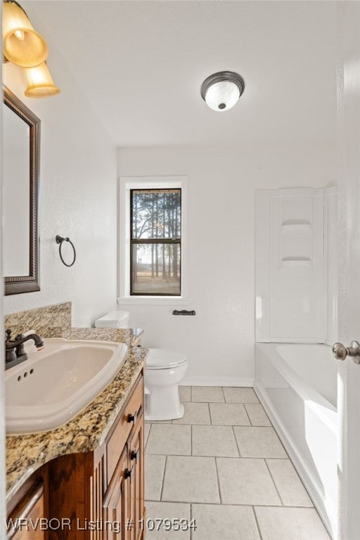 full bathroom featuring tile patterned floors, toilet, vanity, baseboards, and shower / bathtub combination