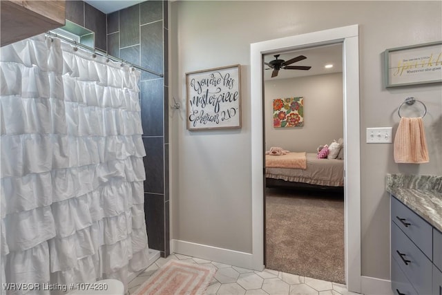 bathroom featuring a shower with shower curtain, tile patterned flooring, ceiling fan, and vanity