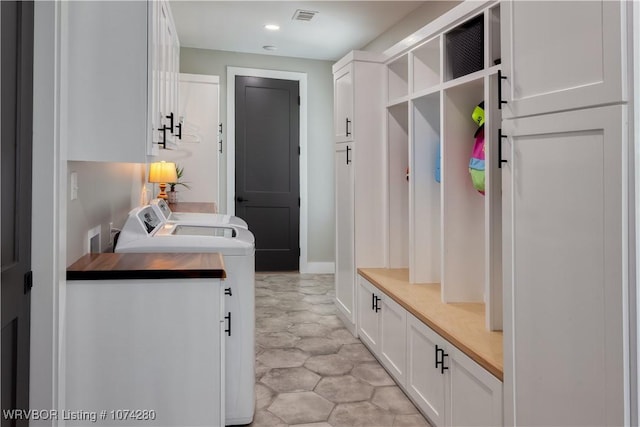 mudroom featuring separate washer and dryer