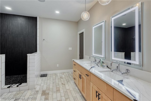 bathroom featuring a shower and vanity