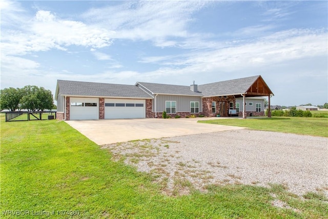 ranch-style home with a garage and a front lawn