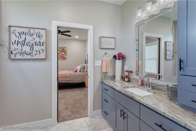 bathroom with ceiling fan and vanity