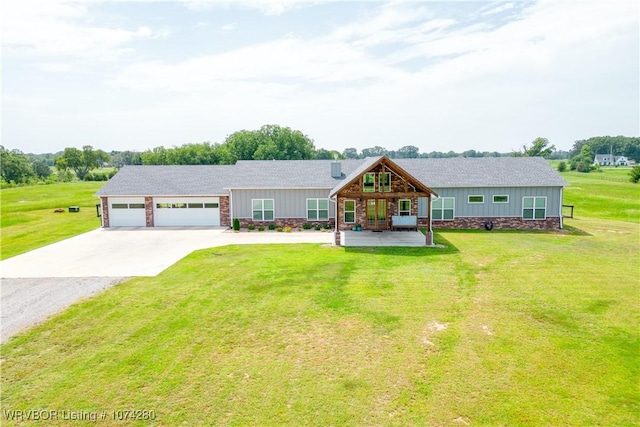 single story home with a garage and a front lawn