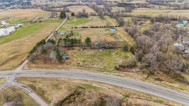 birds eye view of property with a rural view