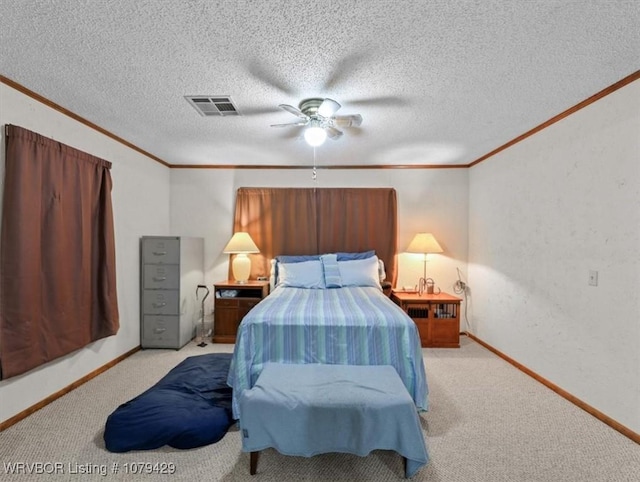 bedroom with crown molding, carpet, visible vents, and a textured ceiling