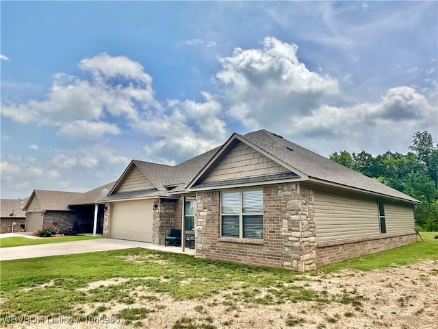 309 Arcadia Dr, Poteau, OK 74953 - view of front of house with concrete driveway, an attached garage, a front lawn, and stone siding