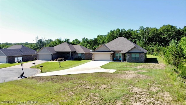 309 Arcadia Dr, Poteau, OK 74953 - view of front of house with concrete driveway, a garage, a front yard, and stone siding