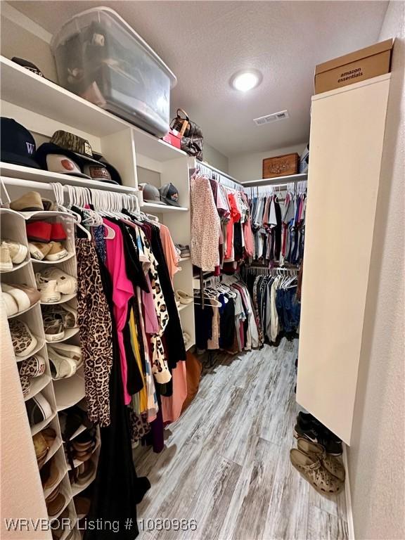 309 Arcadia Dr, Poteau, OK 74953 - spacious closet featuring wood finished floors
