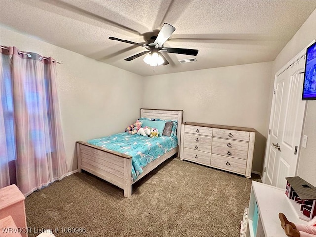 309 Arcadia Dr, Poteau, OK 74953 - carpeted bedroom with a textured ceiling and ceiling fan