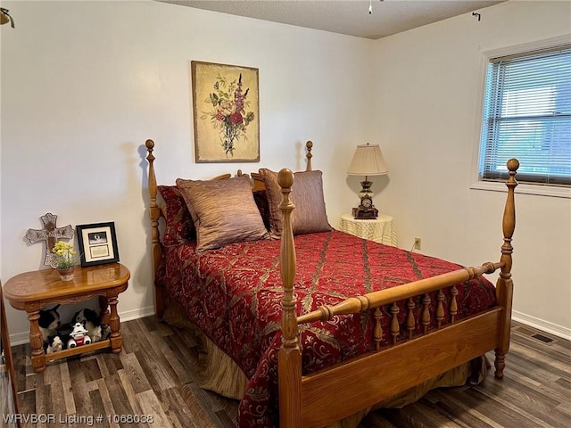 7434 N 217th Hwy, Charleston, AR 72933 - bedroom featuring wood finished floors and baseboards