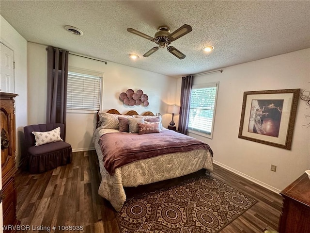7434 N 217th Hwy, Charleston, AR 72933 - bedroom featuring dark wood-style flooring, a textured ceiling, and a ceiling fan