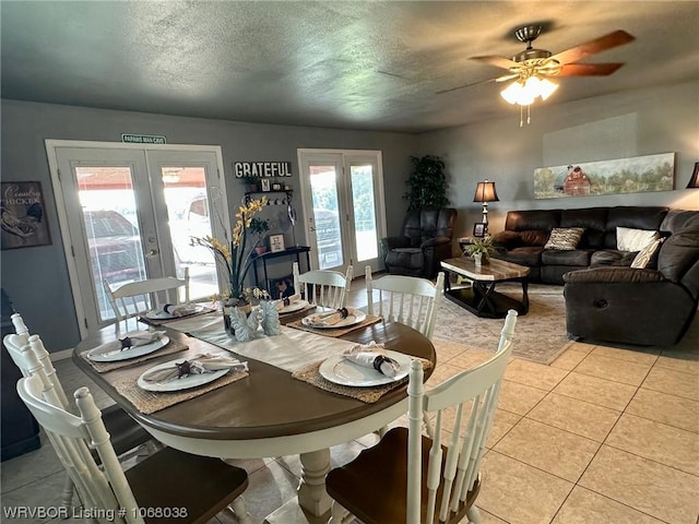 7434 N 217th Hwy, Charleston, AR 72933 - dining area with french doors, light tile patterned flooring, plenty of natural light, a ceiling fan, and a textured ceiling