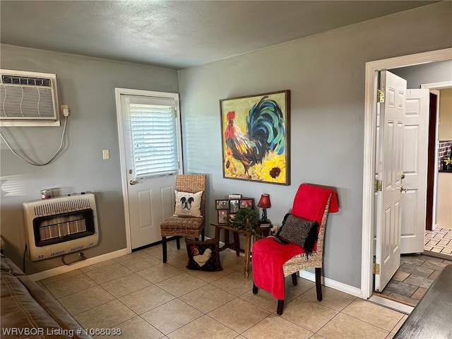 7434 N 217th Hwy, Charleston, AR 72933 - sitting room featuring heating unit, an AC wall unit, and tile patterned flooring