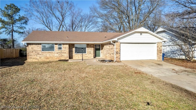 ranch-style house with brick siding, a front lawn, driveway, and a garage