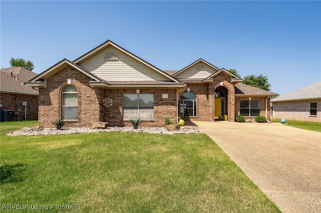 6501 Galven Way, Fort Smith, AR 72916 - view of front facade with brick siding, a front yard, and driveway
