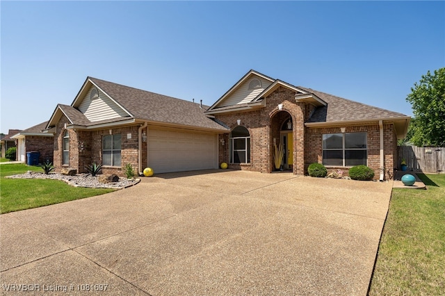 6501 Galven Way, Fort Smith, AR 72916 - view of front of home with brick siding, an attached garage, driveway, and a shingled roof