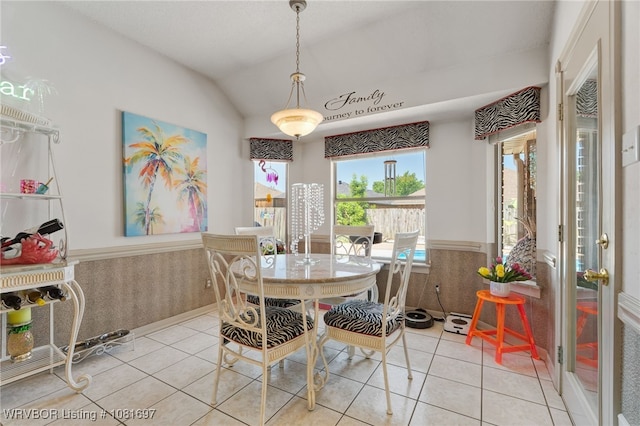 6501 Galven Way, Fort Smith, AR 72916 - dining area featuring light tile patterned floors, vaulted ceiling, and wainscoting