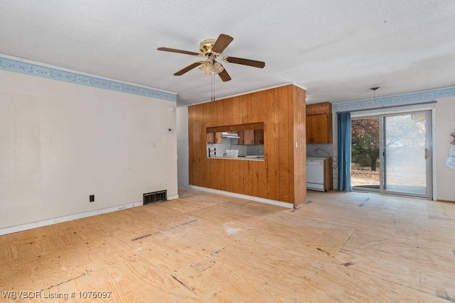 unfurnished living room with ceiling fan and a textured ceiling