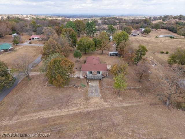 birds eye view of property featuring a rural view