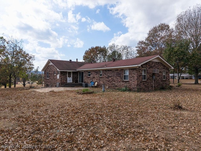 back of house with central AC