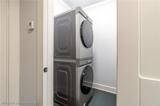 8721 Northshore Dr, Hackett, AR 72937 - laundry area with stacked washing machine and dryer and a textured wall