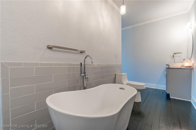 8721 Northshore Dr, Hackett, AR 72937 - full bath with tile walls, vanity, a freestanding tub, ornamental molding, and hardwood / wood-style floors