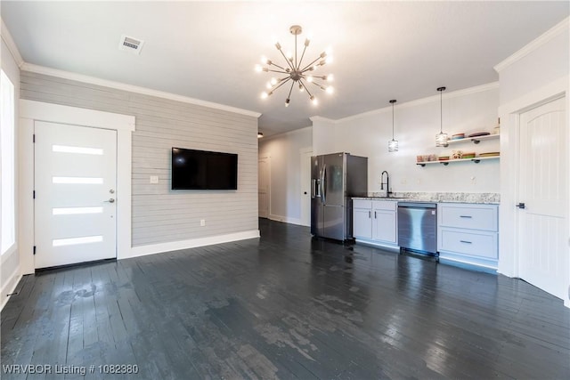 8721 Northshore Dr, Hackett, AR 72937 - kitchen featuring appliances with stainless steel finishes, a chandelier, open floor plan, dark wood-style flooring, and ornamental molding