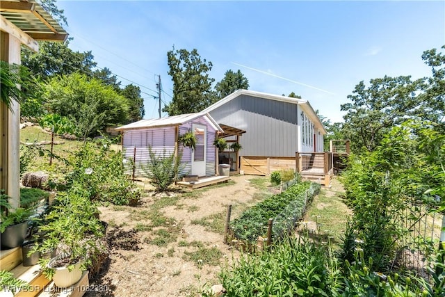 8721 Northshore Dr, Hackett, AR 72937 - back of house with a storage unit and a wooden deck