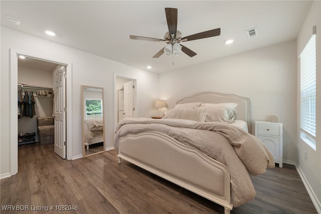 10618 Cedar Way, Fort Smith, AR 72916 - bedroom featuring a spacious closet, wood finished floors, multiple windows, and recessed lighting