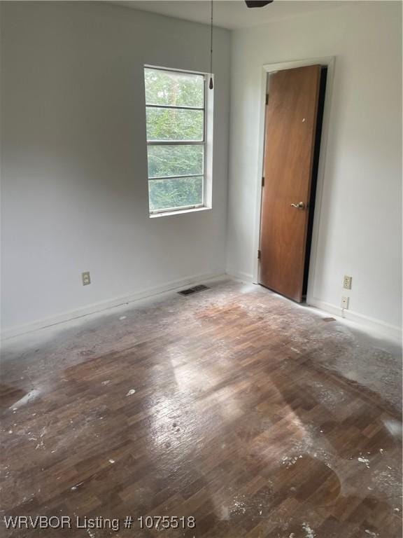 spare room with hardwood / wood-style flooring