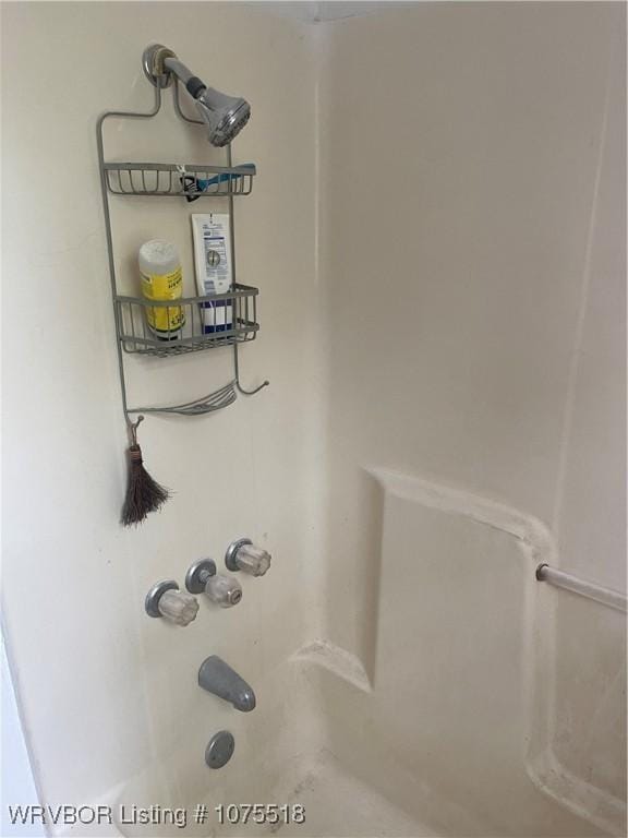 details featuring shower / tub combination