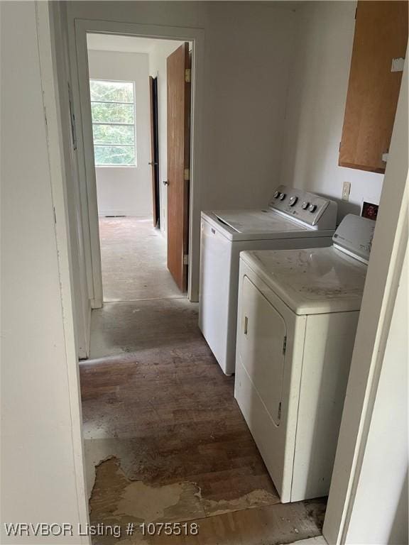 clothes washing area with washer and clothes dryer