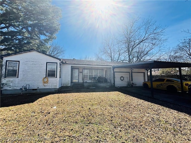 single story home with an attached garage and a front yard