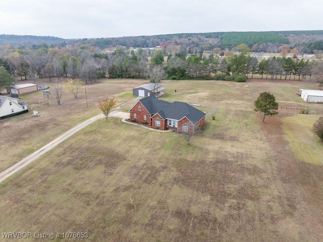 birds eye view of property with a rural view