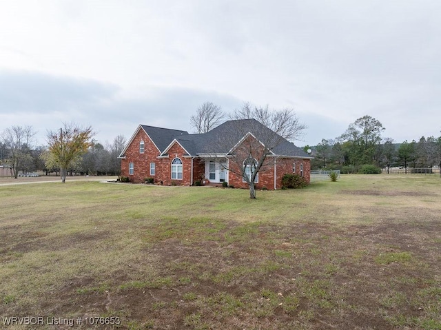 ranch-style house with a front lawn