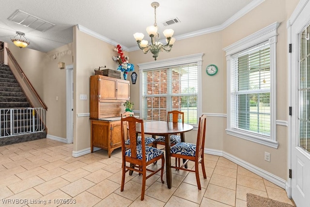 tiled dining room featuring a chandelier and ornamental molding