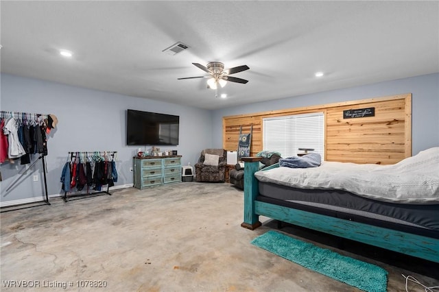 bedroom with ceiling fan and concrete floors