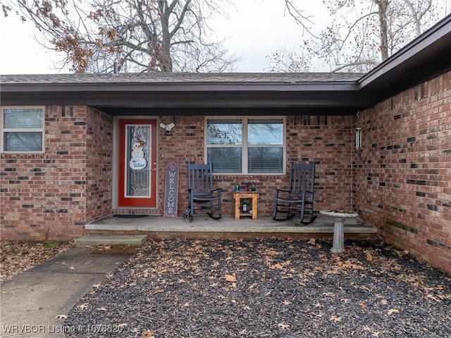 doorway to property featuring covered porch