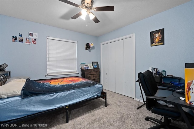 bedroom featuring a closet, ceiling fan, and carpet