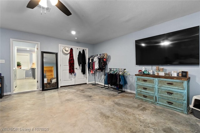 interior space with ceiling fan