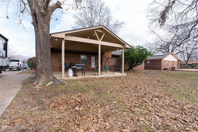 rear view of house with a patio