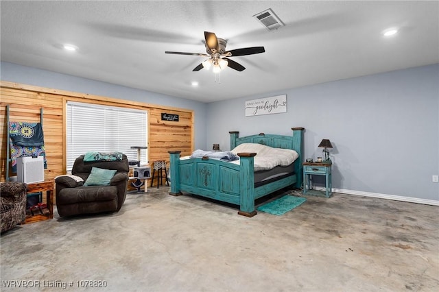 bedroom with concrete flooring and ceiling fan