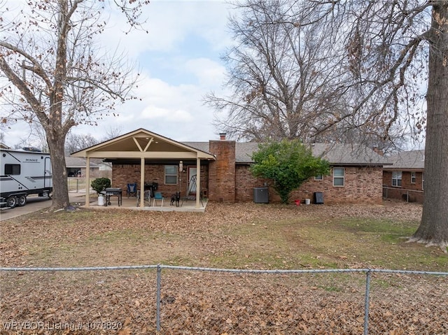 back of house with a patio area and central air condition unit