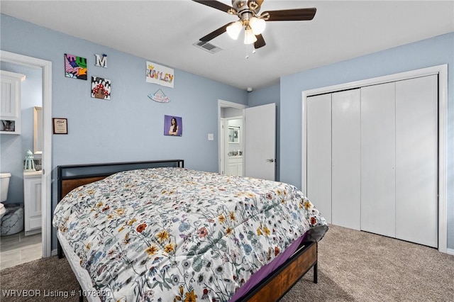 carpeted bedroom featuring ceiling fan and a closet