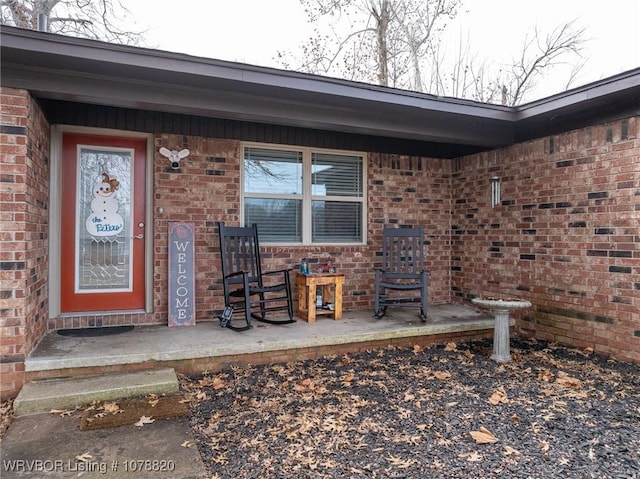 doorway to property with a porch