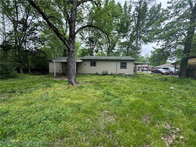 rear view of house with a carport