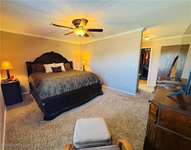 bedroom featuring ceiling fan, ornamental molding, carpet flooring, and a textured ceiling