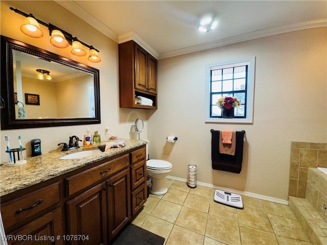 bathroom featuring a bathing tub, vanity, toilet, crown molding, and tile patterned floors